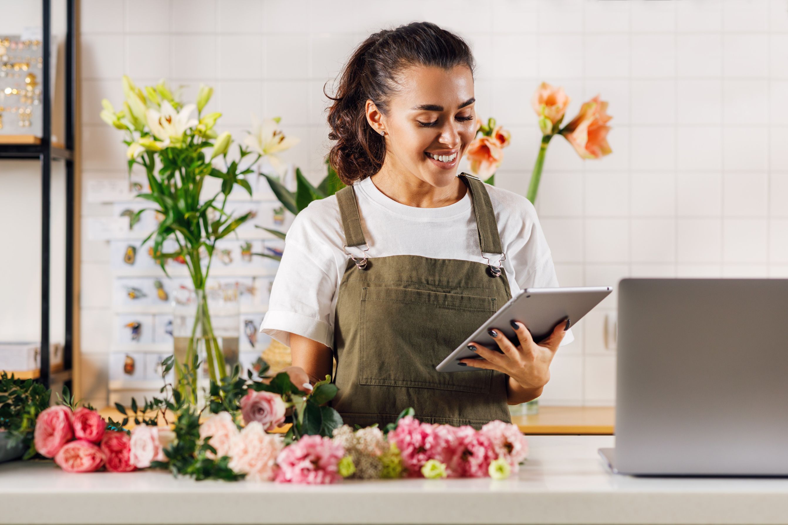 florist sole trader on tablet